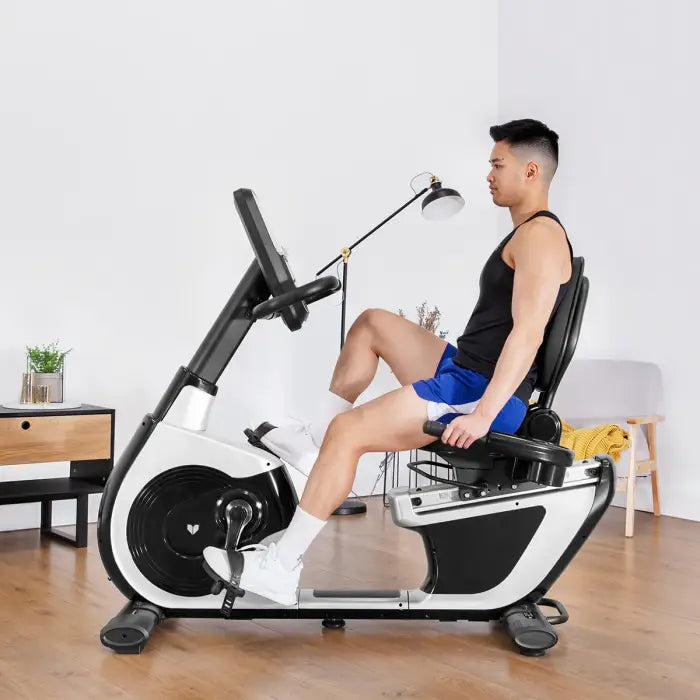 side view of the RBX-100 Recumbent bike with a man on it exercising