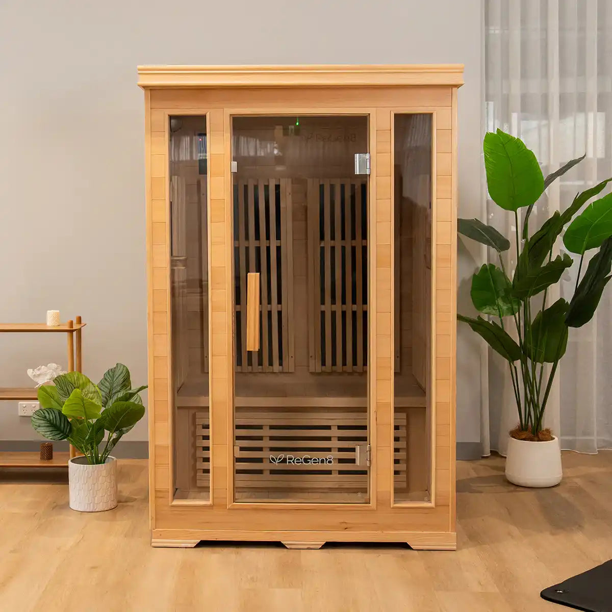 A light wood sauna with a glass door and slatted interior.